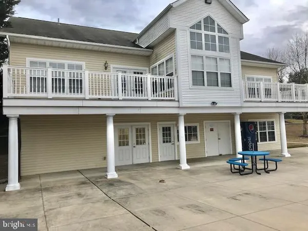 a view of a swimming pool with a table and chairs