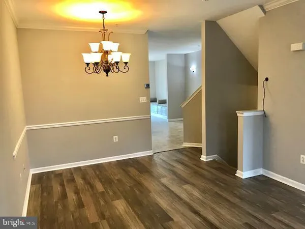 a view of a livingroom with wooden floor