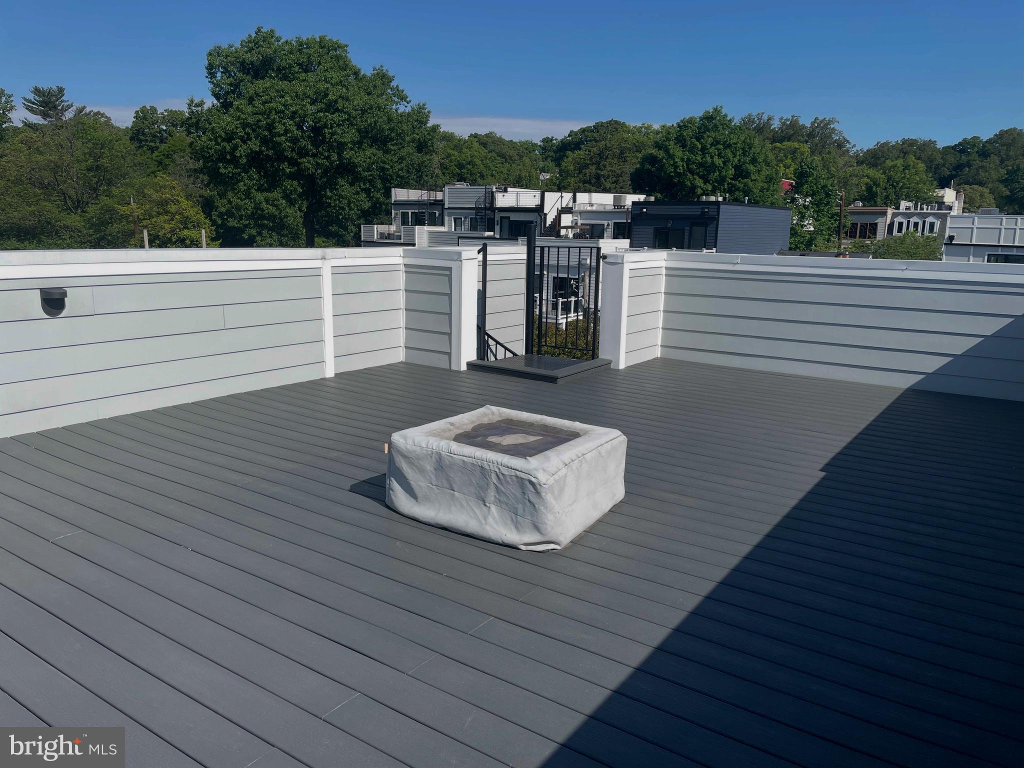 3719 R Street Northwest Washington, DC 20007 - Photo 22 of 44 a roof deck view with a table and chairs