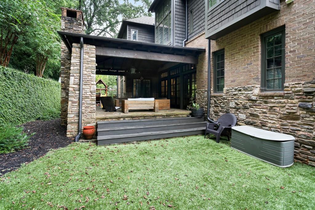 1692 Friar Tuck Road Northeast Atlanta, GA 30309 - Photo 25 of 41 a front view of a house with garden and patio