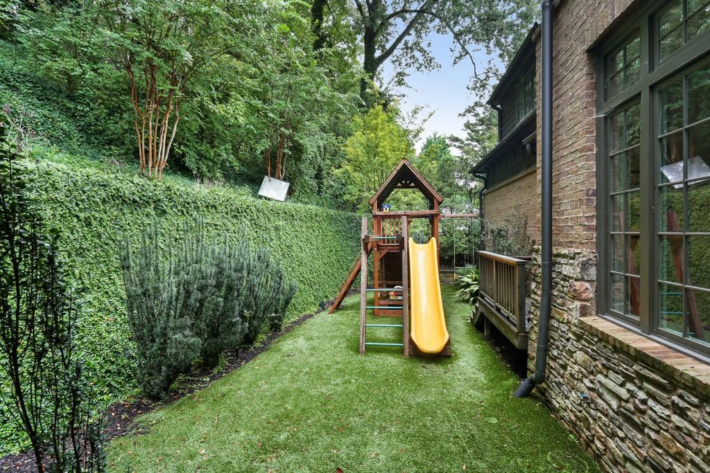 1692 Friar Tuck Road Northeast Atlanta, GA 30309 - Photo 26 of 41 a view of a garden with a slide