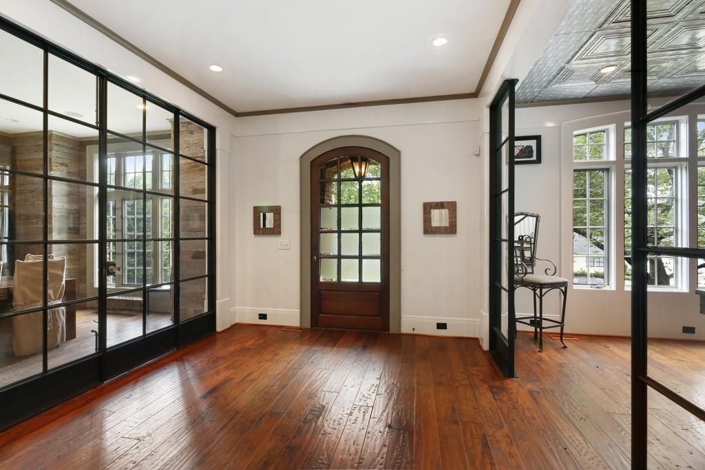 1692 Friar Tuck Road Northeast Atlanta, GA 30309 - Photo 4 of 41 a big room with wooden floors and windows