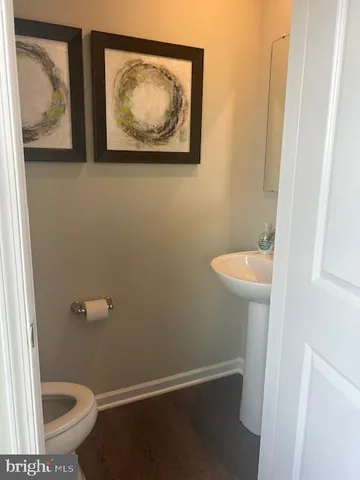 a bathroom with a toilet and a sink