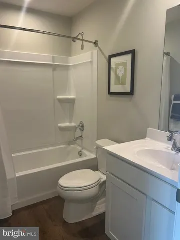a bathroom with a toilet a sink and a bathtub