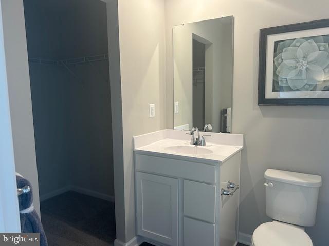 2562 Laurel Pk Drive Culpeper, VA 22701 - Photo 18 of 23 a bathroom with a toilet a sink and mirror