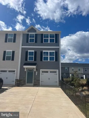 a front view of a building with many windows