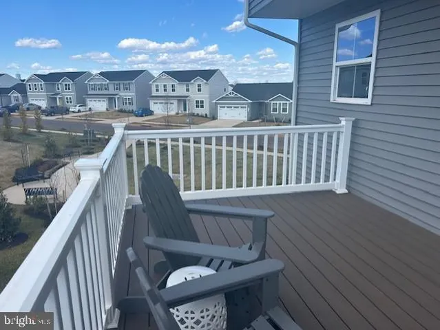 a view of a balcony with furniture