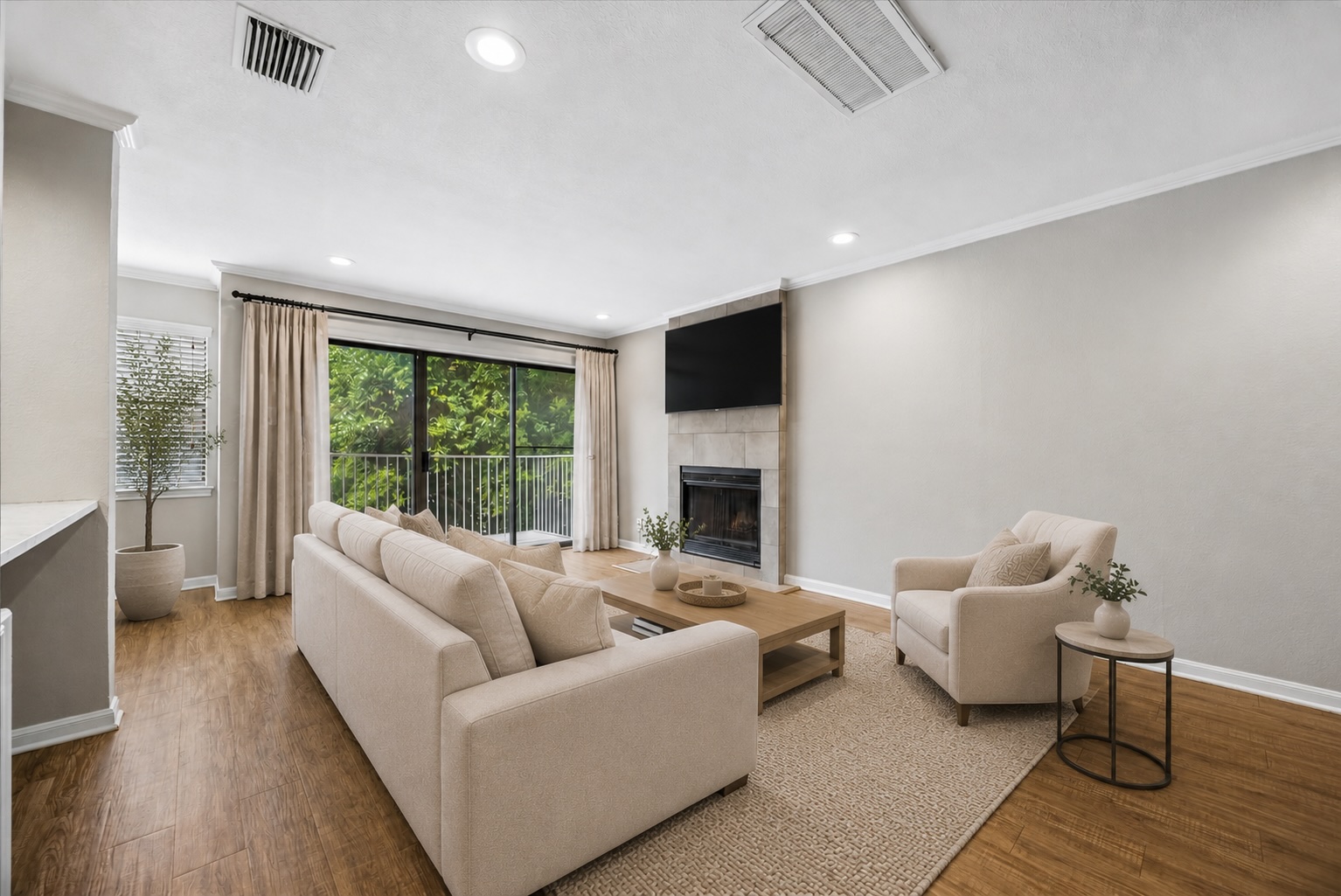 3845 Ranch Road 2222, Unit 33 Austin, TX 78731 - Photo 1 of 21 a living room with furniture and a fireplace