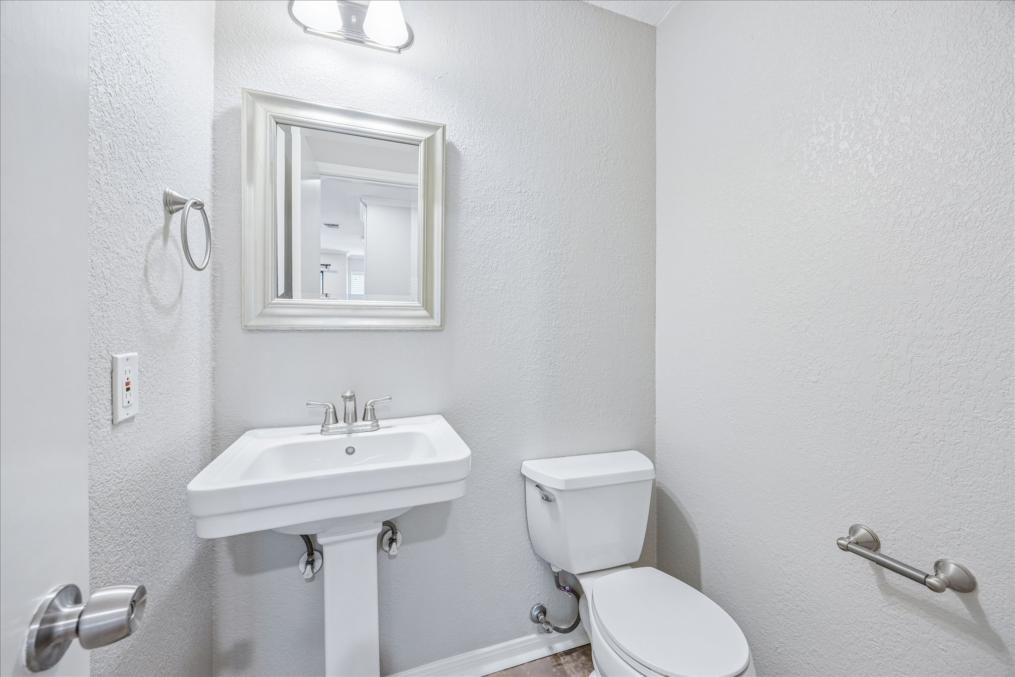 3845 Ranch Road 2222, Unit 33 Austin, TX 78731 - Photo 9 of 21 a bathroom with a toilet sink and mirror