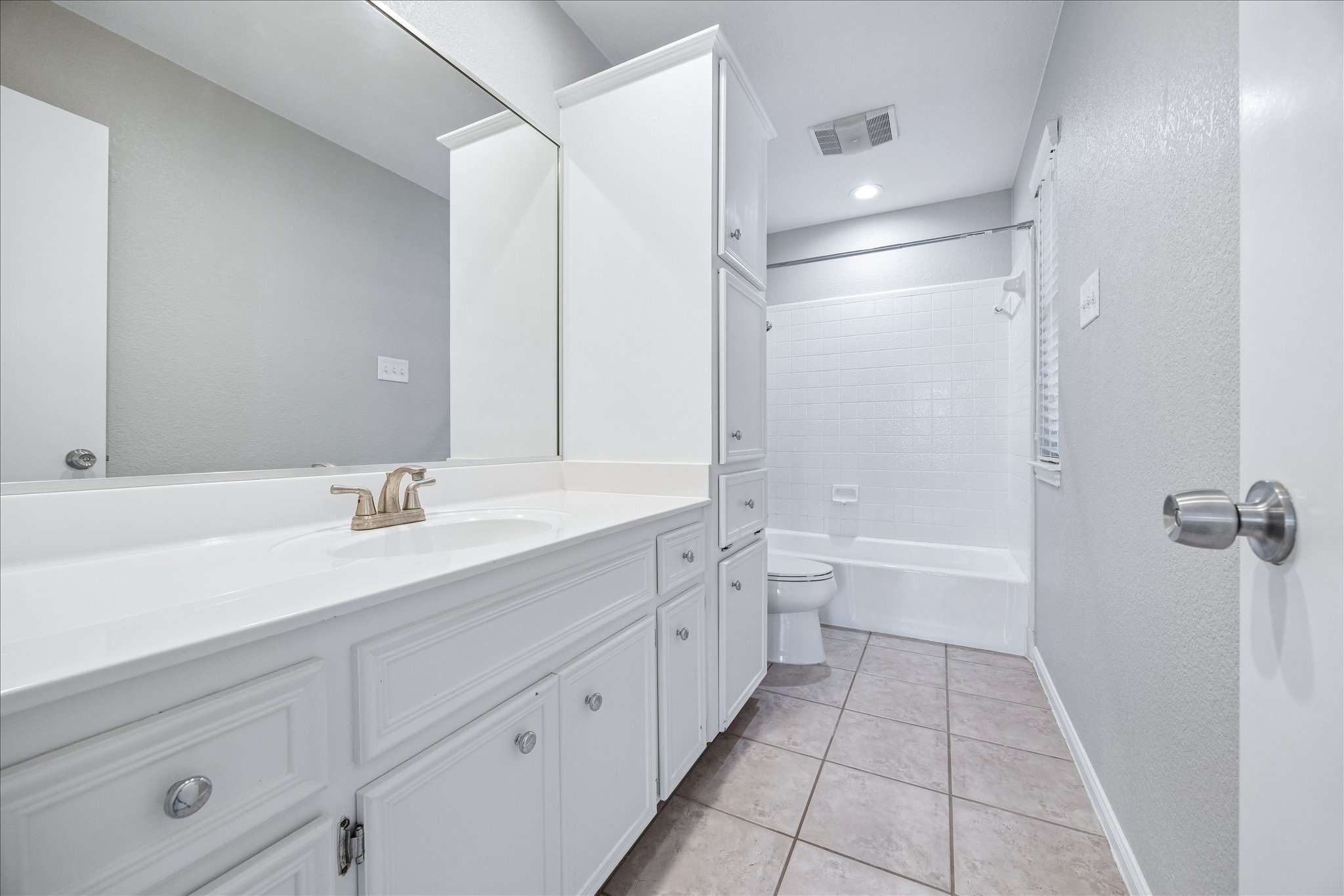 3845 Ranch Road 2222, Unit 33 Austin, TX 78731 - Photo 10 of 21 a bathroom with a double vanity sink toilet mirror and bathtub