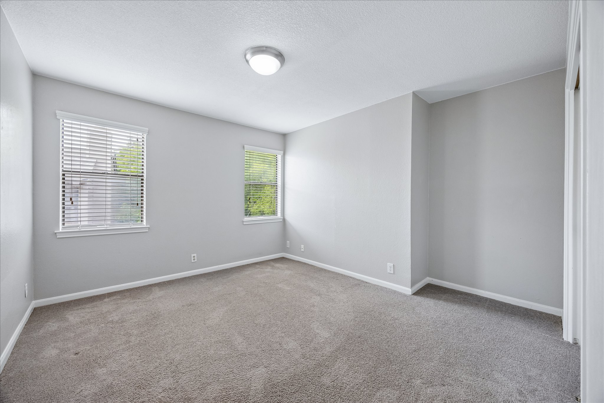3845 Ranch Road 2222, Unit 33 Austin, TX 78731 - Photo 11 of 21 an empty room with windows