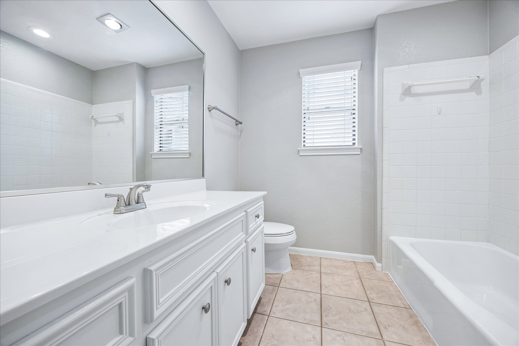 3845 Ranch Road 2222, Unit 33 Austin, TX 78731 - Photo 12 of 21 a bathroom with a sink a toilet and a bathtub