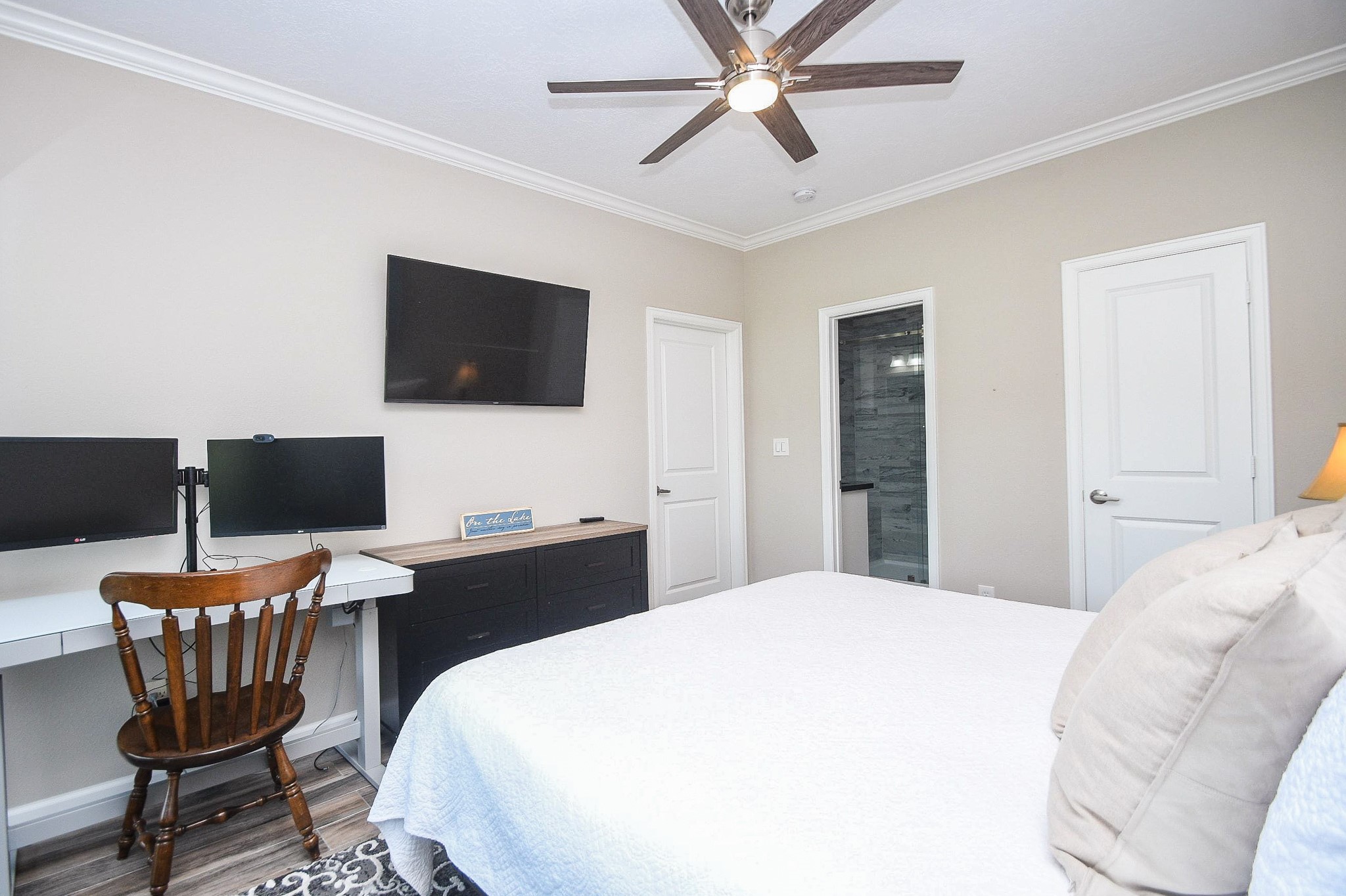 500 River Road, Unit 101 Montgomery, TX 77356 - Photo 8 of 27 Primary bedroom with walk-in closet, mounted TV and en suite bathroom