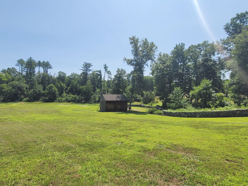 0 Old Dunstable Road Groton, MA 01450 - Photo 15 of 32 a view of a big yard with an trees