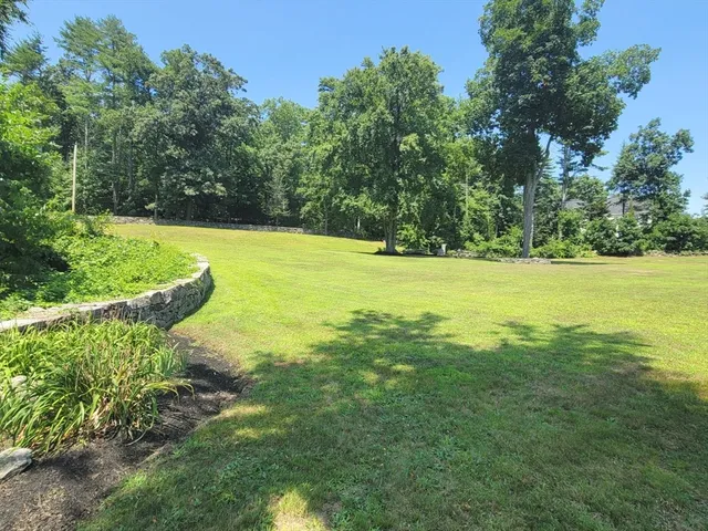 a view of an ocean and a yard