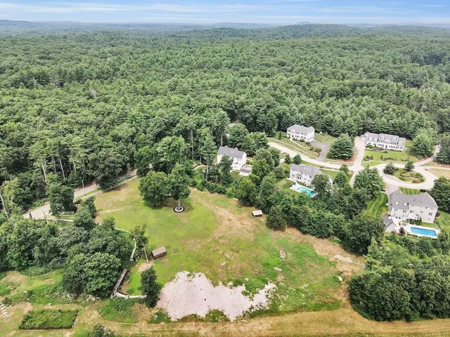 a view of a lake with a yard