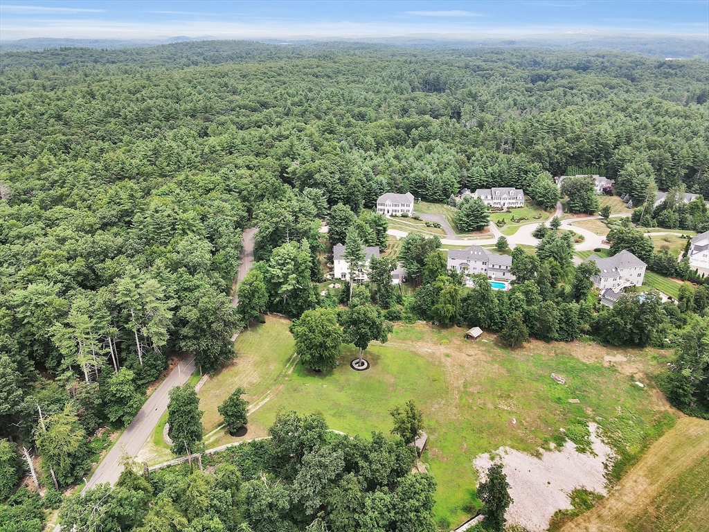 0 Old Dunstable Road Groton, MA 01450 - Photo 30 of 32 an aerial view of residential houses with outdoor space and trees