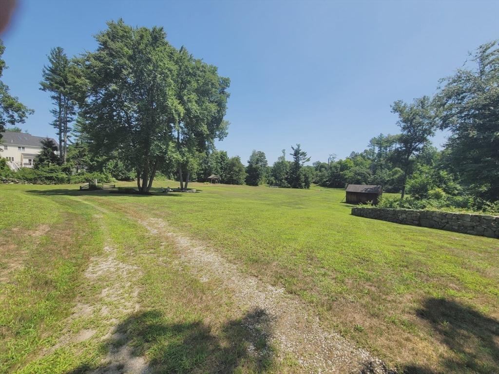 0 Old Dunstable Road Groton, MA 01450 - Photo 6 of 32 a view of a green field with a tree