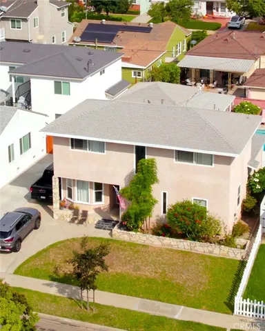a view of multiple houses with a swimming pool