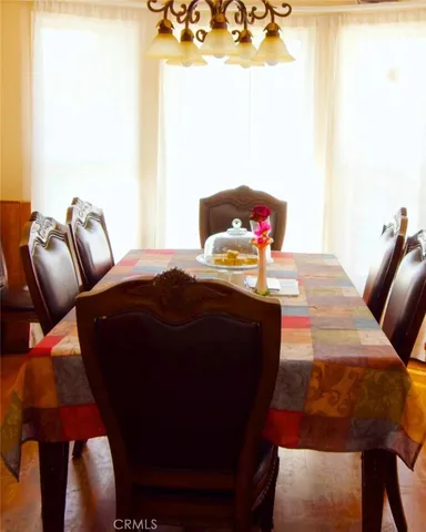 a living room with furniture and a lamp