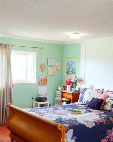 a view of a yard with table and chairs and potted plants