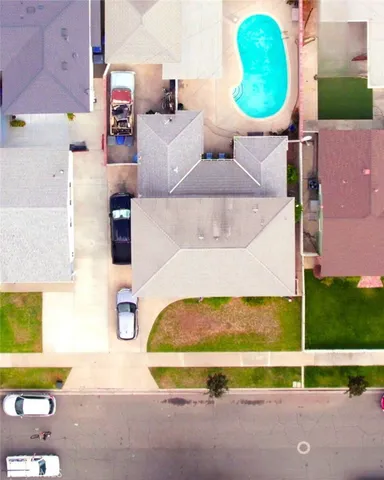 an aerial view of a house with swimming pool