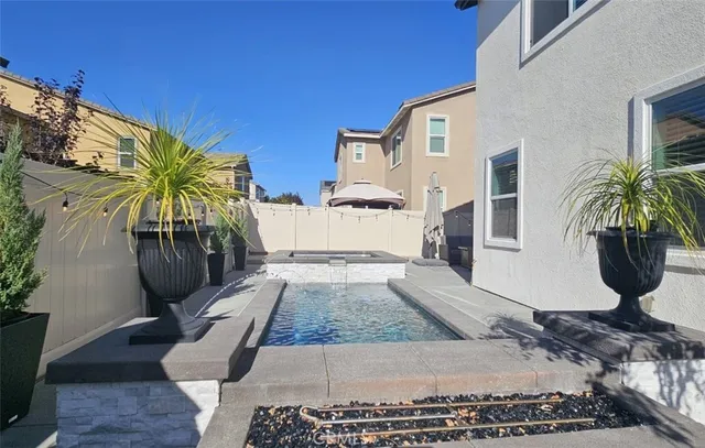a view of staircase with lots of furniture and a window