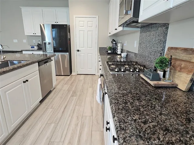 a bedroom with a bed and a mirror