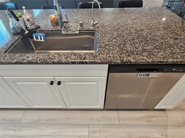 a view of staircase with railing and white walls