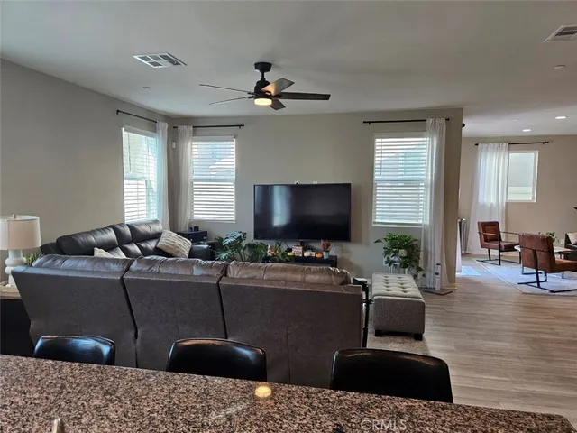 a spacious bedroom with a bed and a window