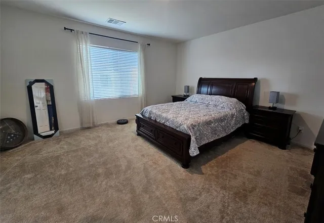 a view of a livingroom with furniture and a window