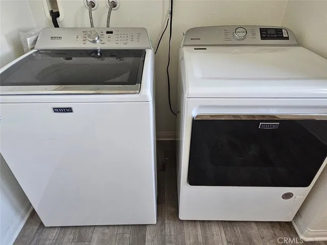 a view of a livingroom with wooden floor