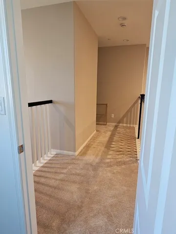 a living room with game table furniture and a flat screen tv