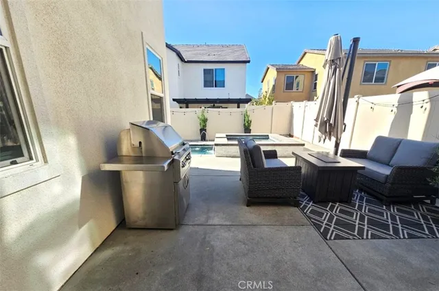 a kitchen with stainless steel appliances granite countertop a sink and a refrigerator