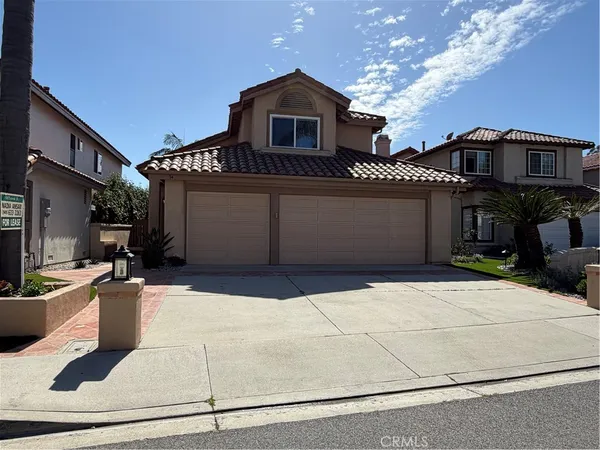 a front view of a house with a garage