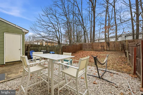 a view of a patio with iron fence