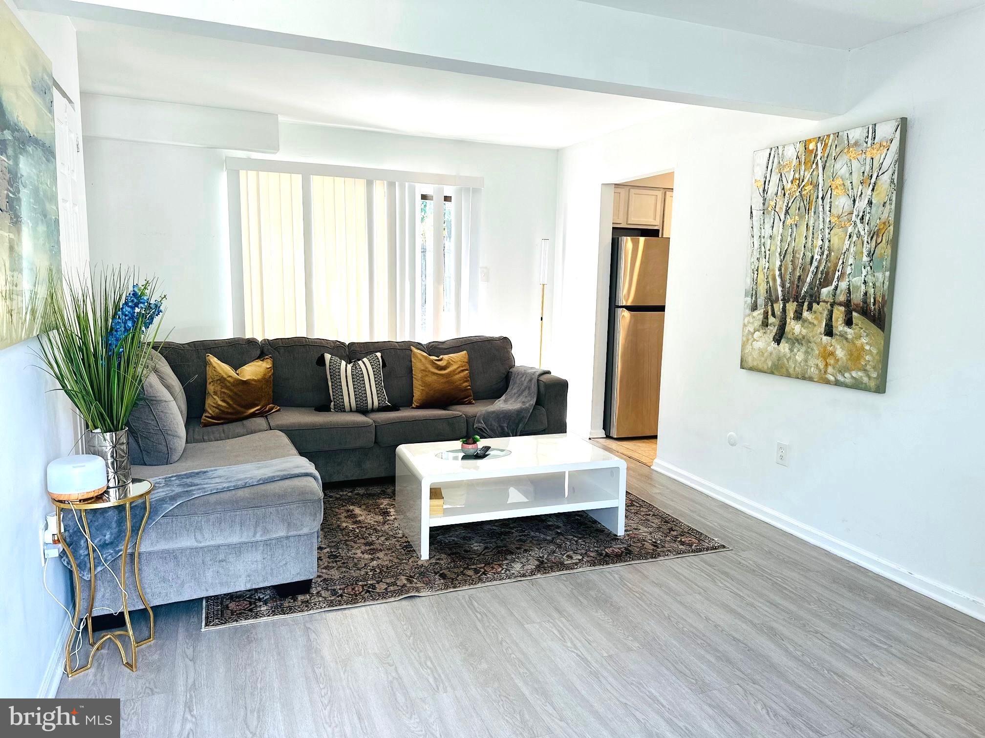 31 Brookshire Road Sicklerville, NJ 08081 - Photo 2 of 12 a living room with furniture and a wooden floor