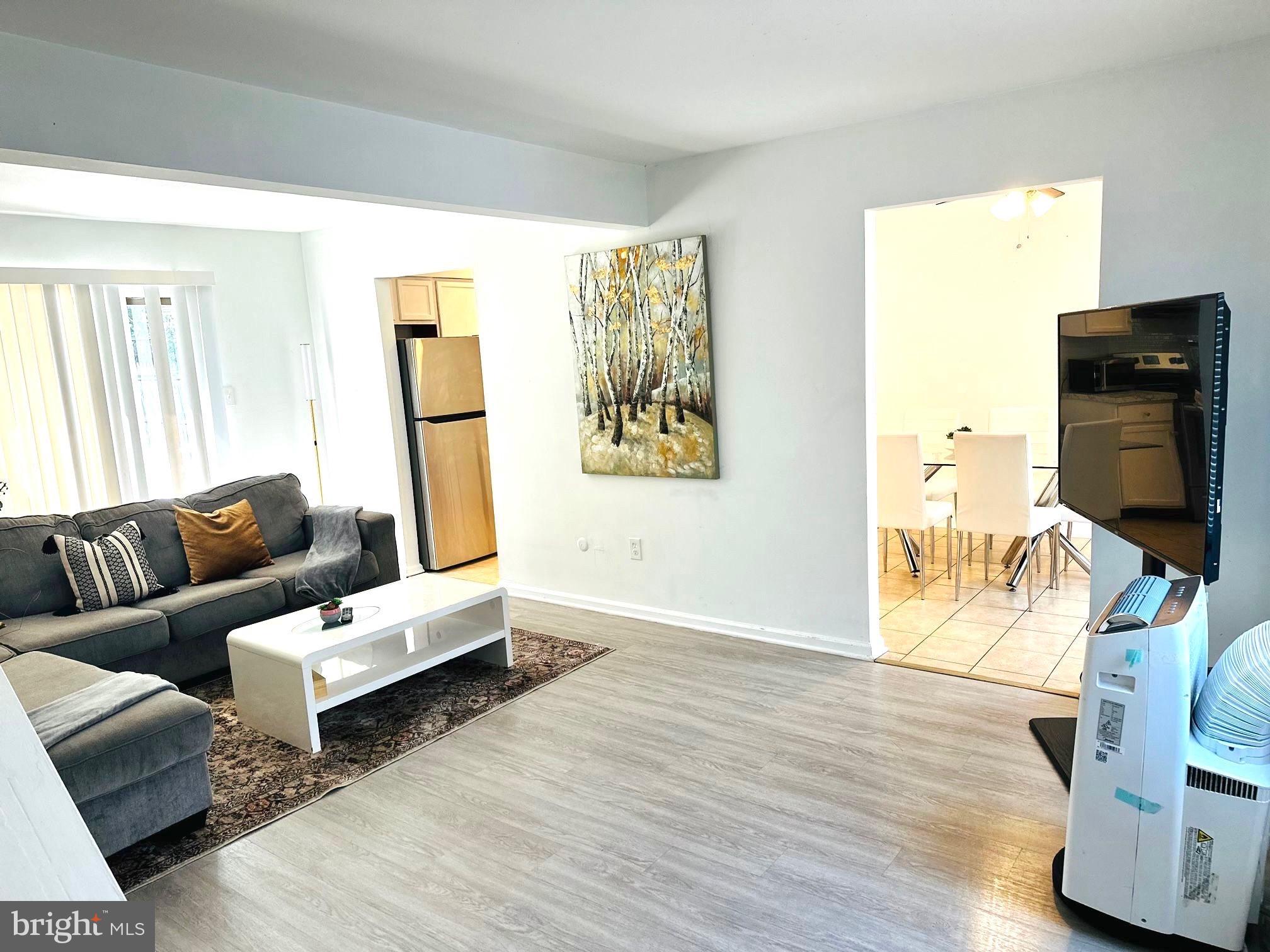 31 Brookshire Road Sicklerville, NJ 08081 - Photo 3 of 12 a living room with furniture and a flat screen tv