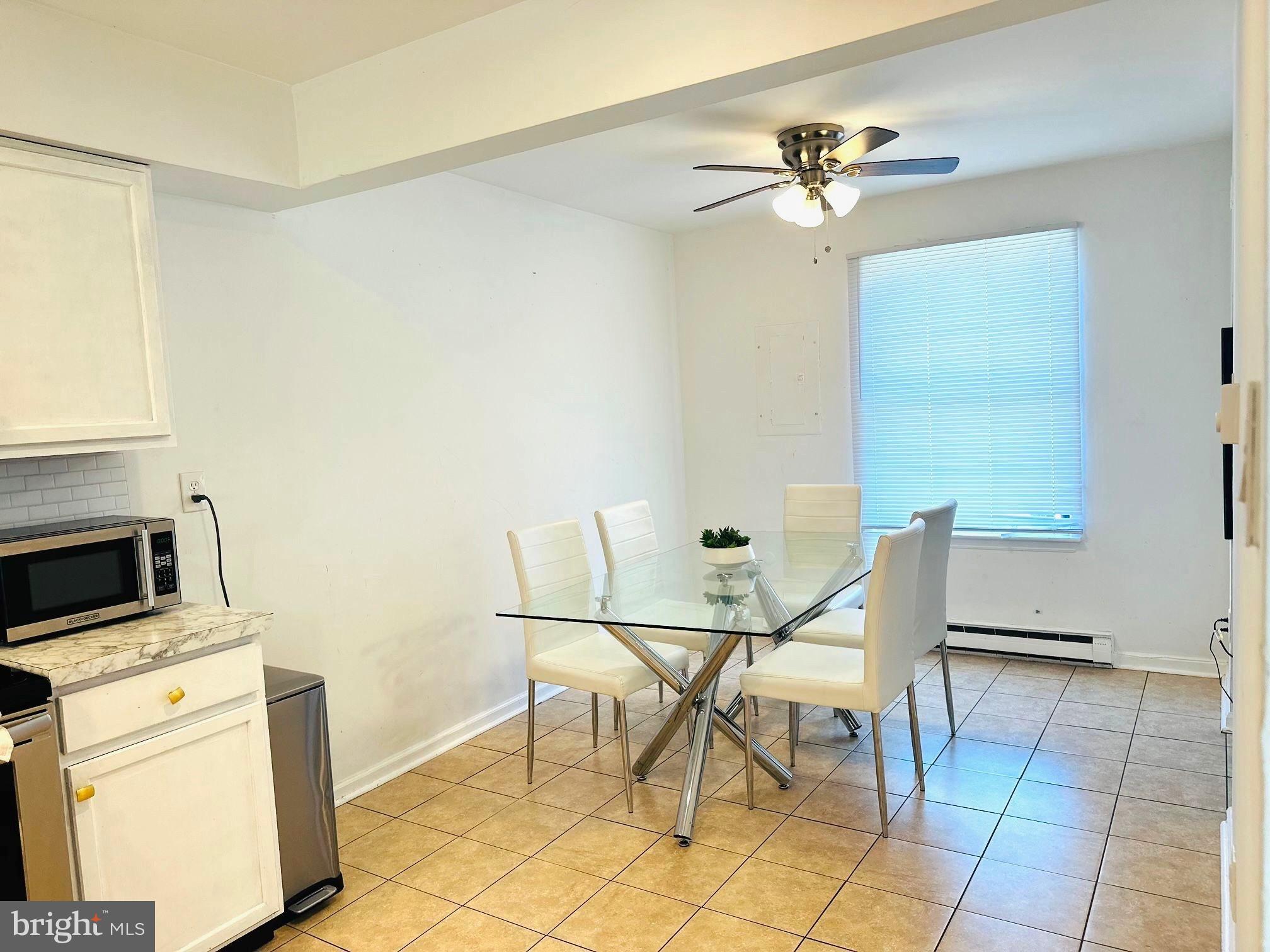 31 Brookshire Road Sicklerville, NJ 08081 - Photo 4 of 12 a view of a dining room with furniture and a chandelier fan