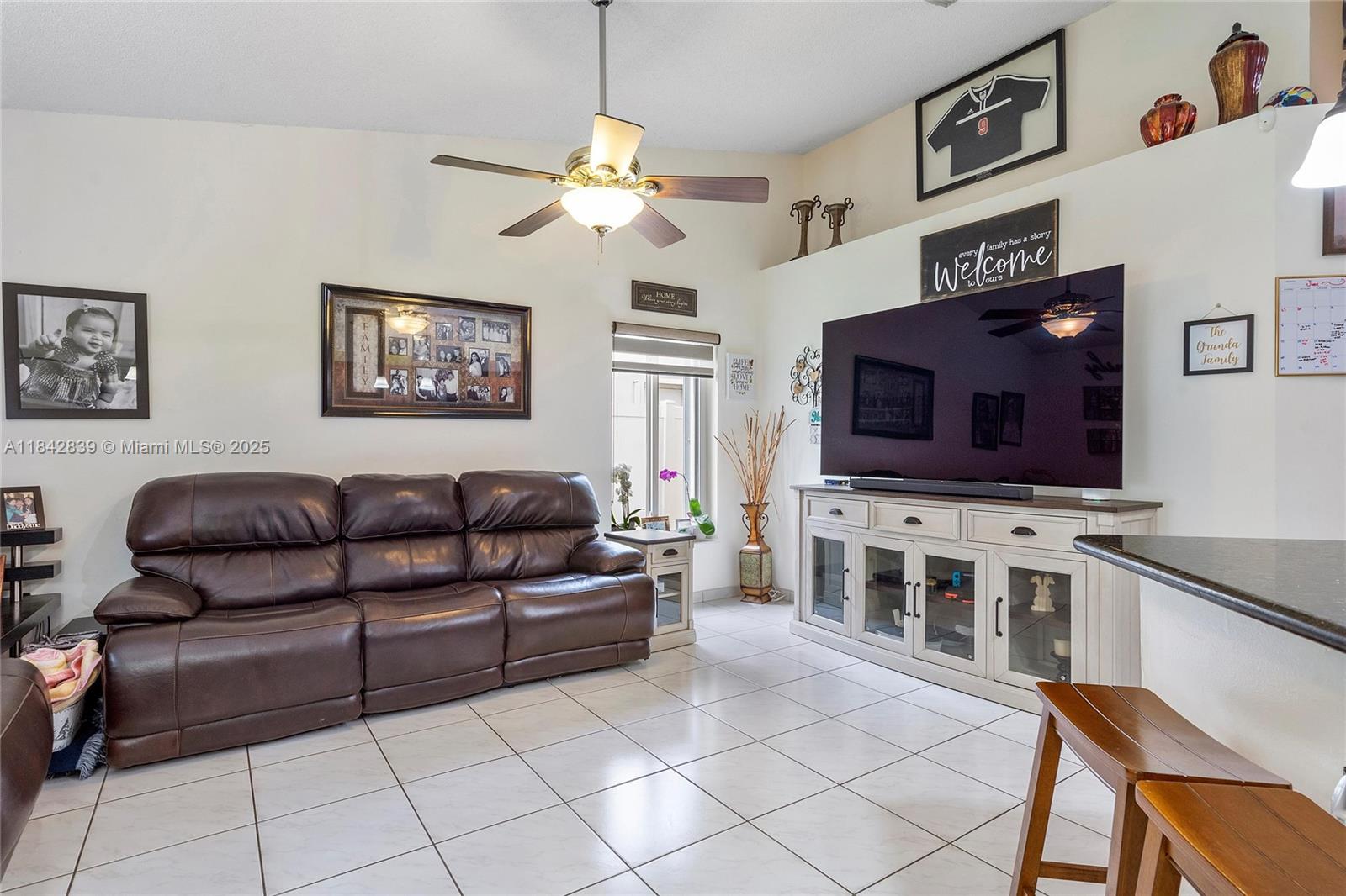 1841 Southwest 124th Way Miramar, FL 33027 - Photo 15 of 34 a living room with furniture and a flat screen tv
