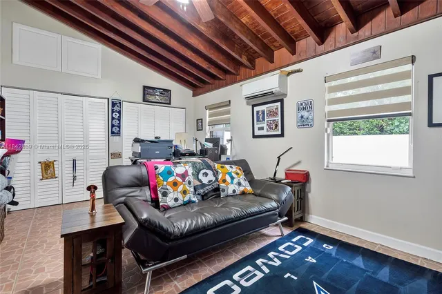 a living room with furniture and a window