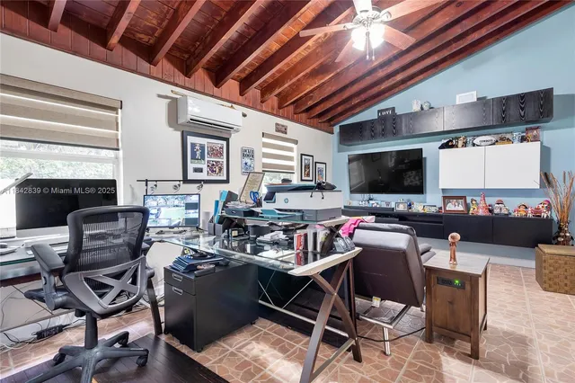 a living room with lots of furniture and a flat screen tv