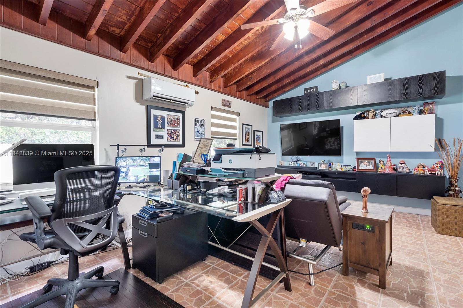 1841 Southwest 124th Way Miramar, FL 33027 - Photo 22 of 34 a living room with lots of furniture and a flat screen tv