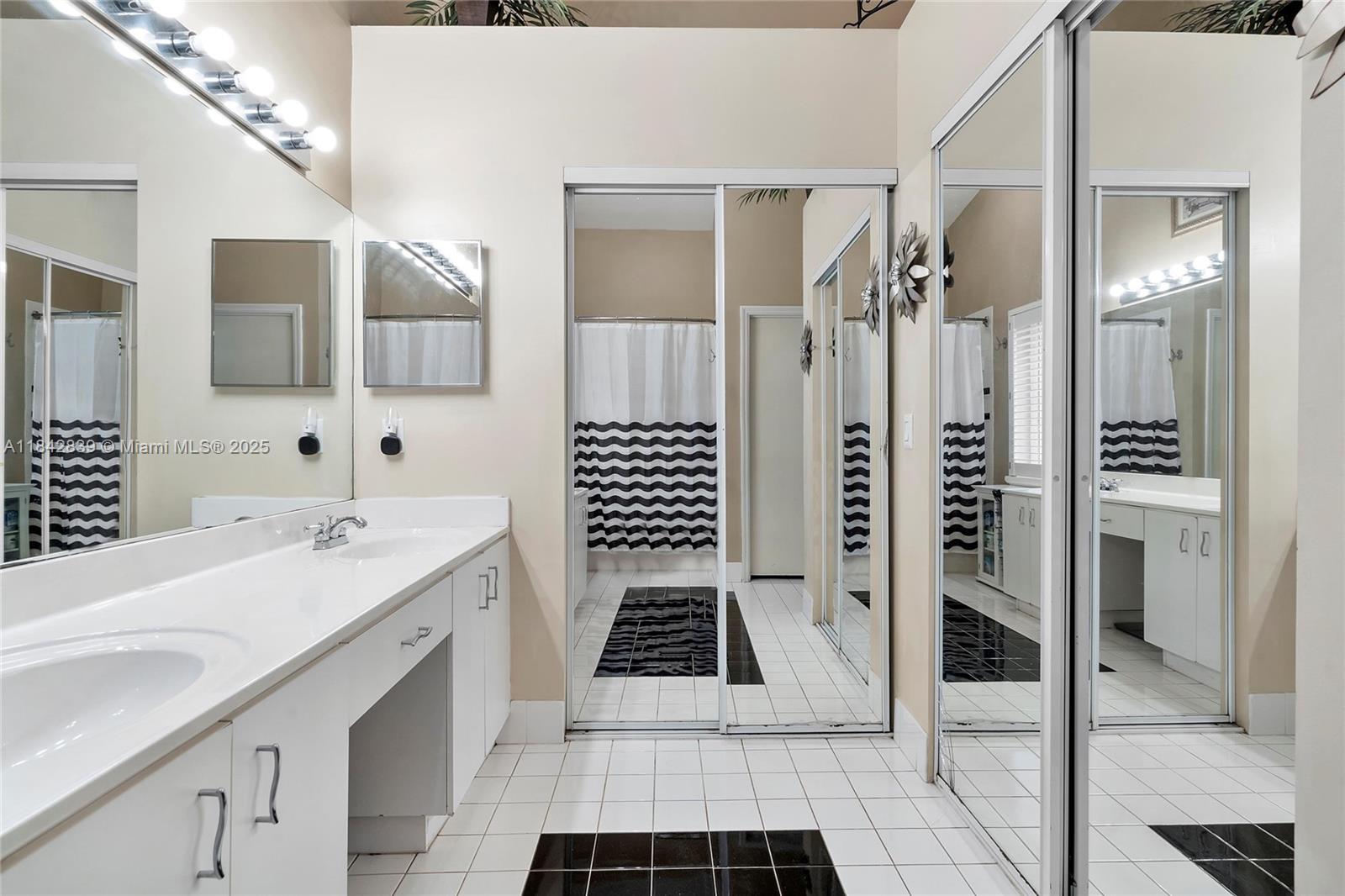 1841 Southwest 124th Way Miramar, FL 33027 - Photo 25 of 34 a bathroom with a sink a toilet and shower