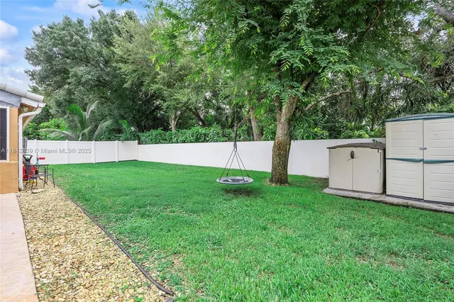 a view of backyard with green space