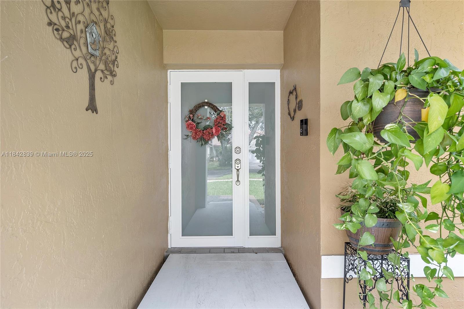 1841 Southwest 124th Way Miramar, FL 33027 - Photo 4 of 34 a view of a hallway with entryway