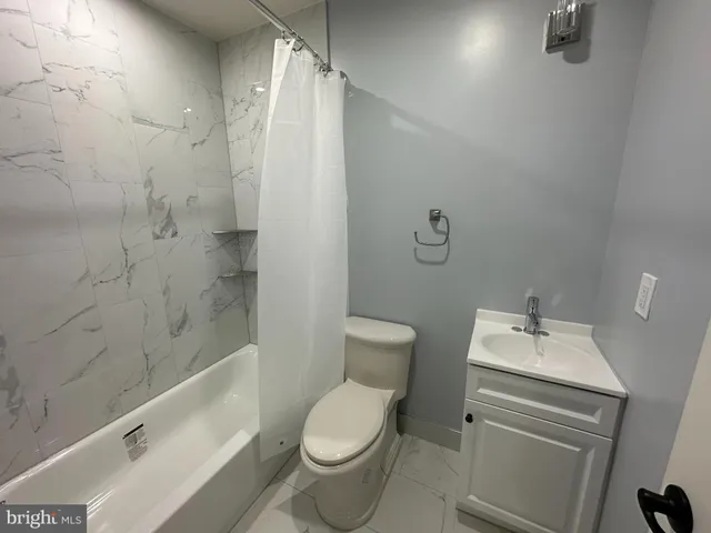 a bathroom with a sink and shower