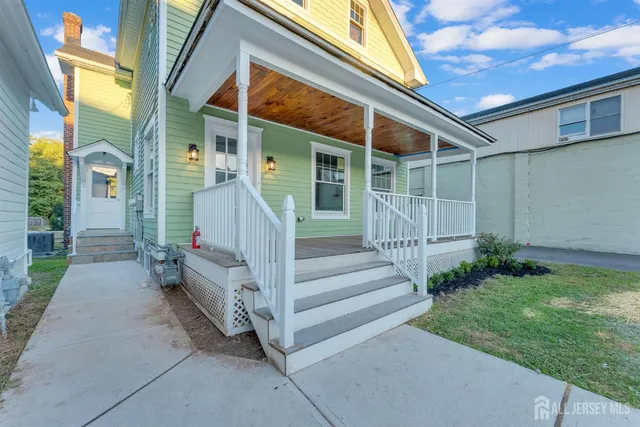 a view of house with wooden floor and a fence