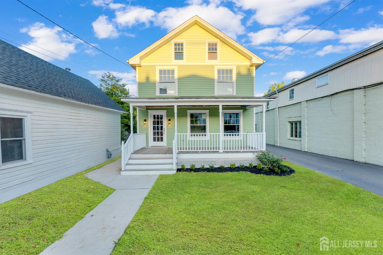 15 North Main Street, Unit B Pennington, NJ 08534 - Photo 16 of 16 a front view of a house with a yard