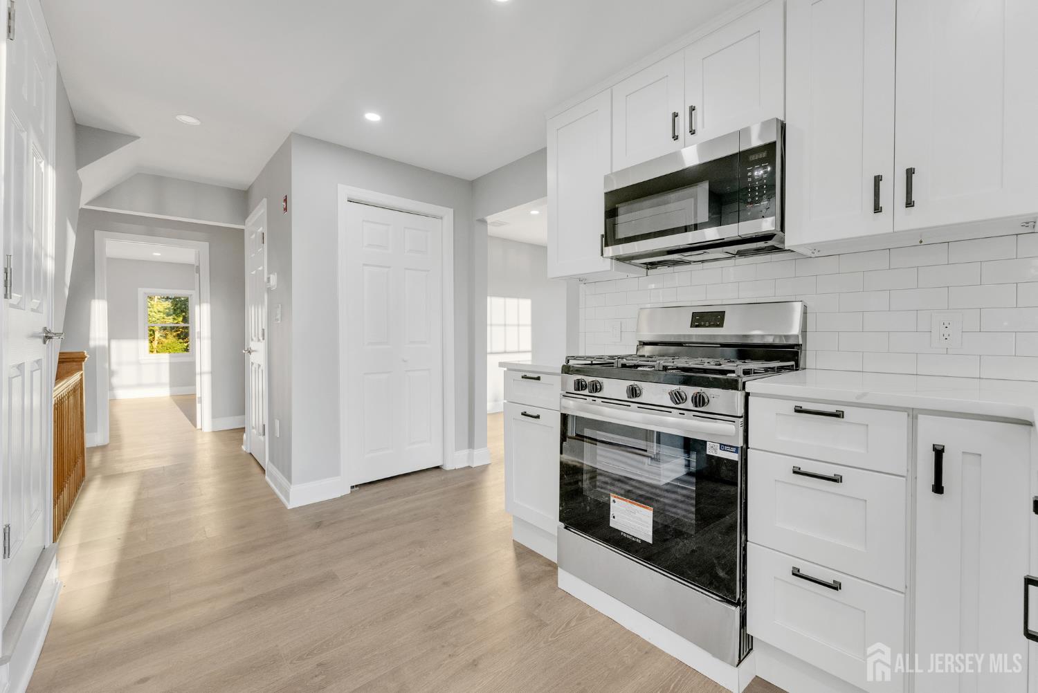 15 North Main Street, Unit B Pennington, NJ 08534 - Photo 3 of 16 a kitchen with stainless steel appliances a stove a microwave and sink